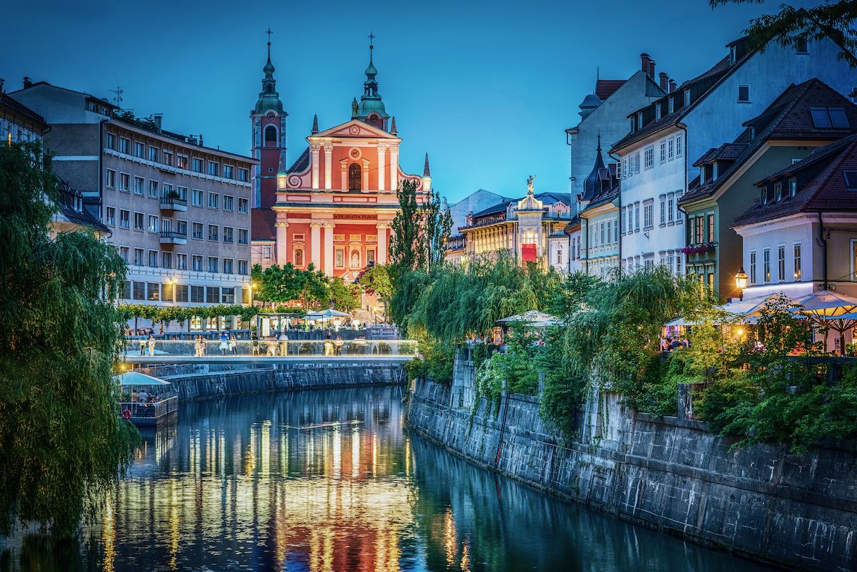 Evening view of the bridge and Ljubljanica river in the city center. Ljubljana, capital of Slovenia.